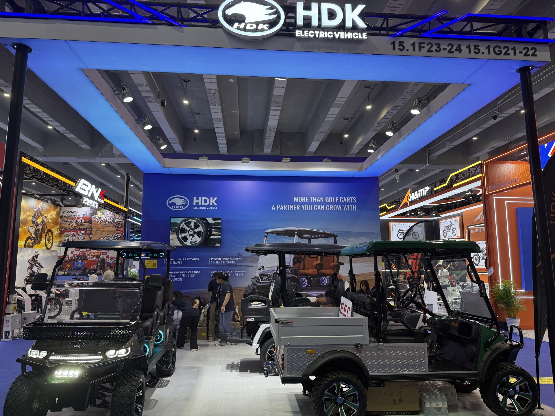 HDK booth at Area C Hall 15.1 of the 140th Canton Fair showing utility and passenger vehicles